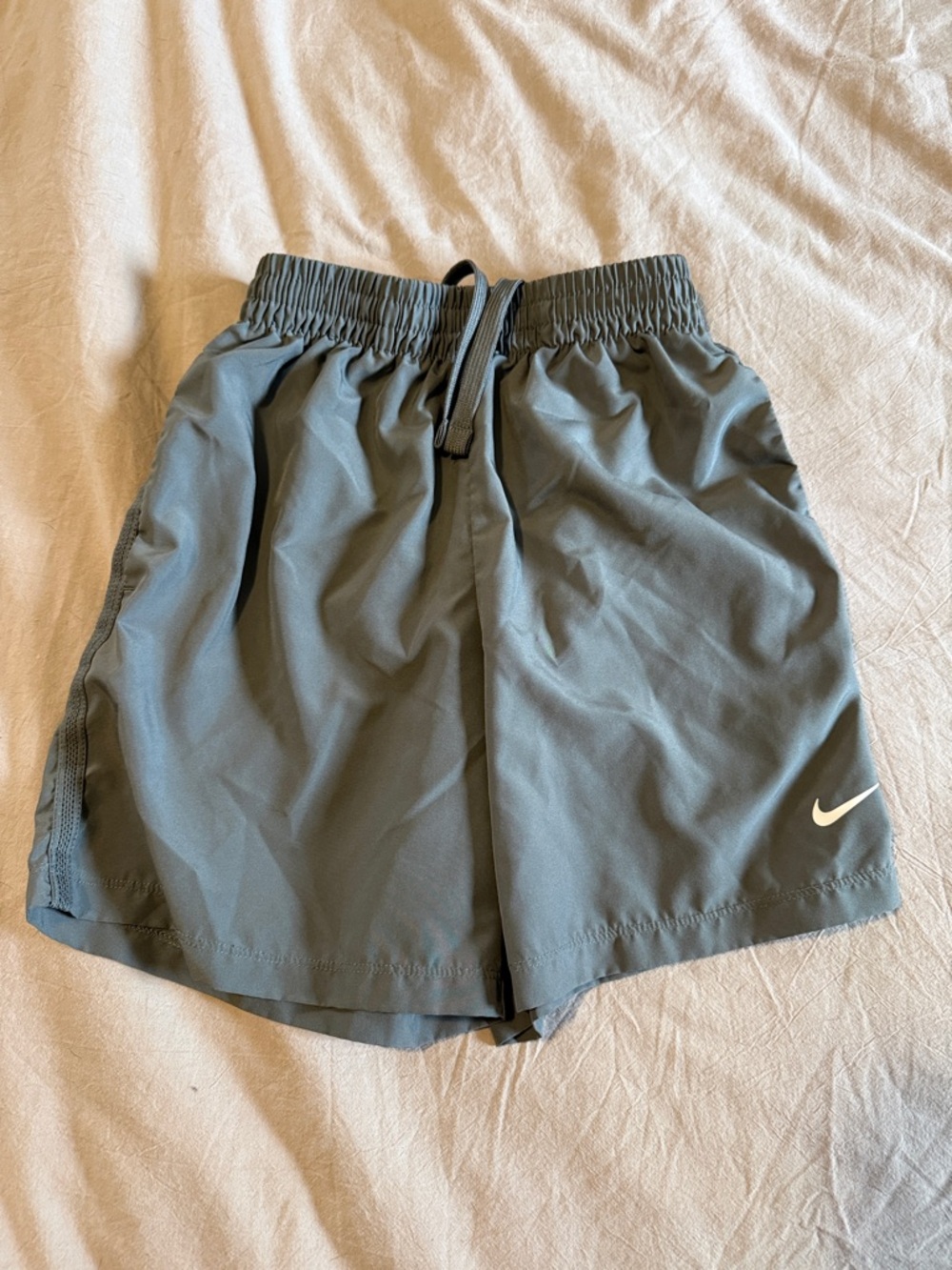 Kids Nike Gray Athletic Shorts with White Swoosh